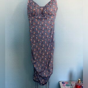 Blue dress with flowers, tie and scrunch side style.